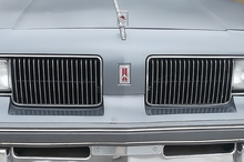 Load image into Gallery viewer, OER Front Header Panel Rocket Euro Emblem For 1987-1988 Cutlass Supreme