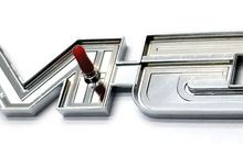Load image into Gallery viewer, Trim Parts Tailgate Emblem 1975-1980 GMC Trucks With Brushed Aluminum Tailgate